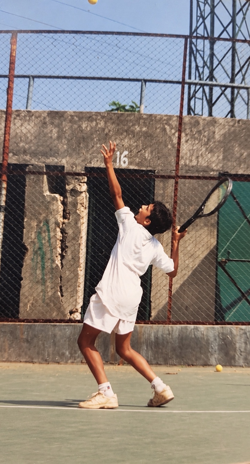 Original childhood tennis photograph, serving on court